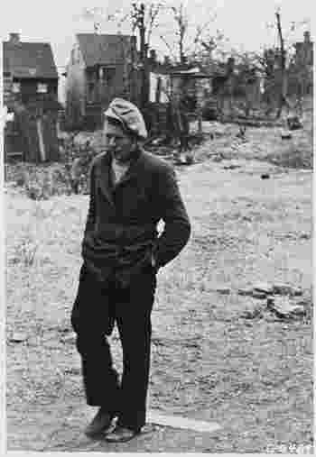 Depression Unemployed, Man Dressed Poorly Walking With Head Down, Shacks In Background, No Credit Typical Picture... NARA 195916